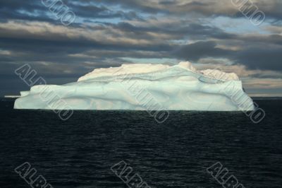 Iceberg with surrealistic blue swirls,
