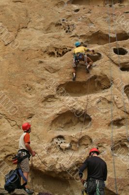 Potholes, climbers on rock face