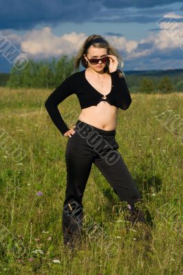Portrait of the young beautiful girl on the nature