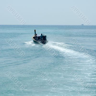 fisherman in a longtail boat