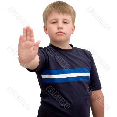 stop. young boy with hand outstretched