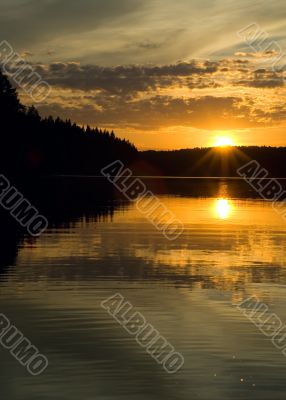 sunset over the lake and forest