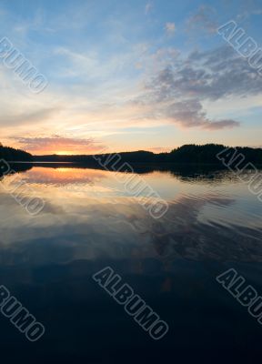 sunset over the lake and forest