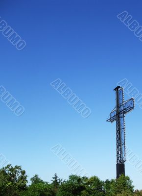 Cross Rises Above Trees