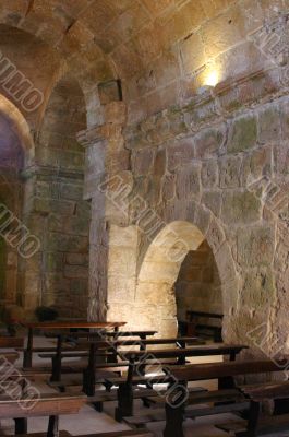 Pews and stone wall