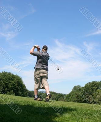 Man playing golf