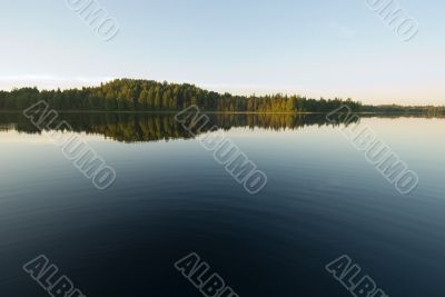 deep blue waters of forest lake