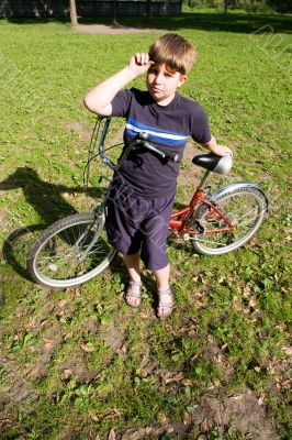 Boy with bicycle