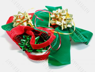 Festive ribbons and bows and red bag