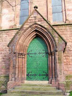 An imposing door with metal studs