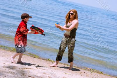 Mother and Son playing at the beach
