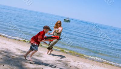 Mother and Son playing at the beach