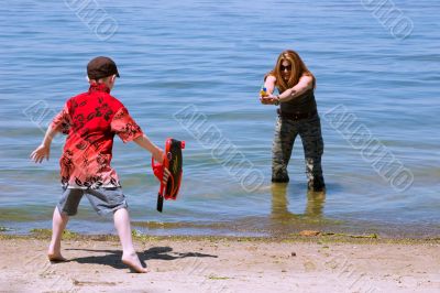 Mother and Son playing at the beach