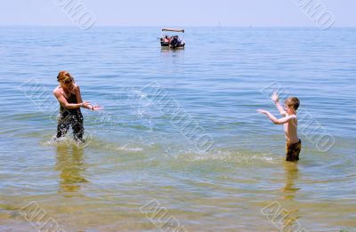 Mother and Son playing at the beach