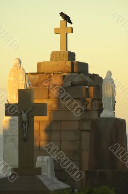 crow on tomb cross