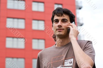 The man calls by a mobile phone.