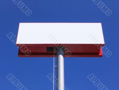 Blank billboard over blue sky