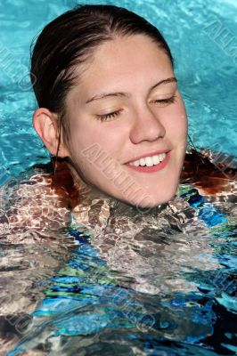 Happy girl in a pool