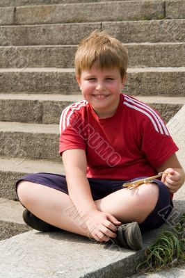 boy with the toy lizard