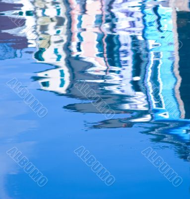 Colorful houses reflection in the water