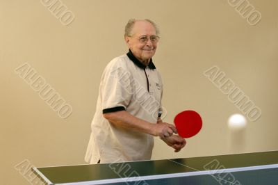 Grandfather playing ping pong