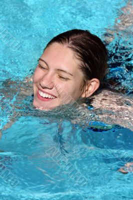 Happy girl in a pool