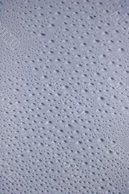 Drippy spots on glass pane.