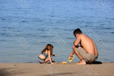 Father and daughter on the beach
