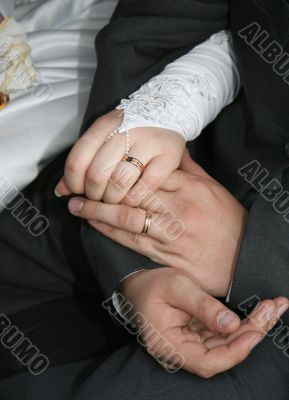 Hands with wedding rings