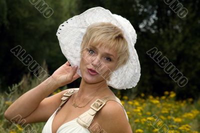 blonde woman in a white hat