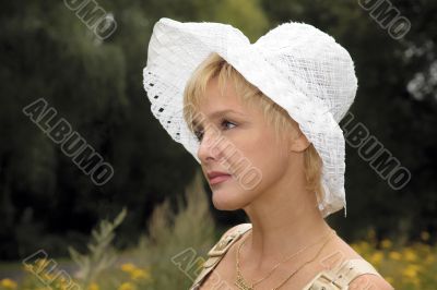blonde woman in a white hat