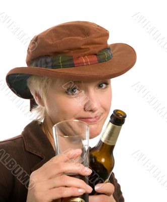 blonde woman in a hat with a beer bottle
