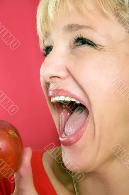 blonde woman with a peach on a red background