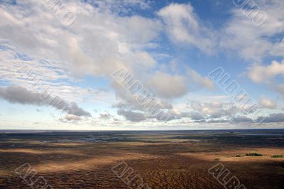 Clouds on marsh.
