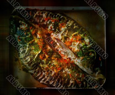 Baked fish on the griddle