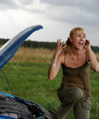 young woman with her broken car
