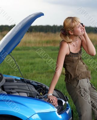 young woman with her broken car