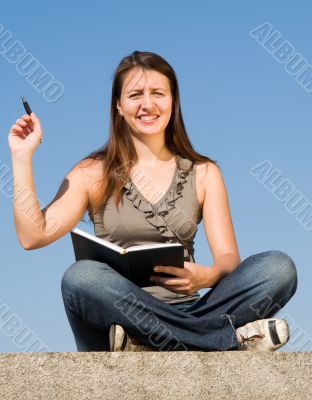 girl with writing-book and pen
