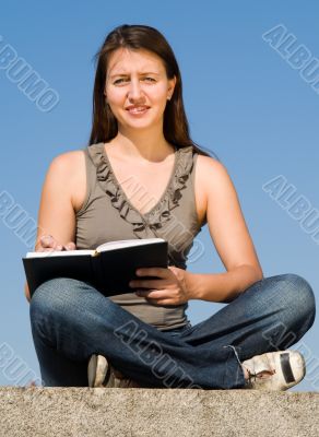 girl taking notes