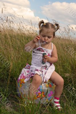 Baby with soap bubble