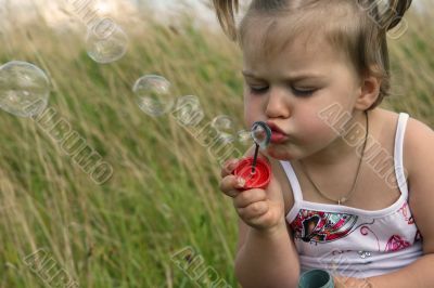 Baby with soap bubble