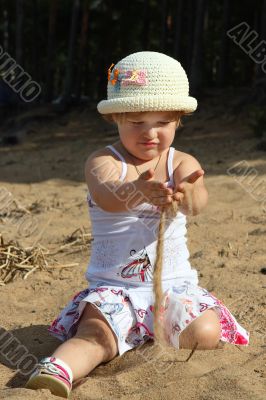 Child plays sand