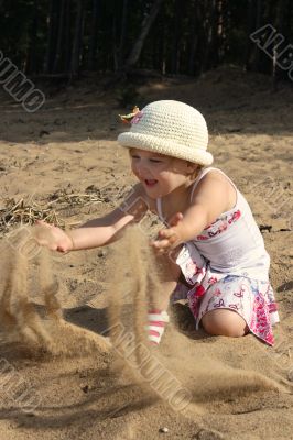 Child plays sand