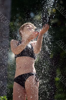 Woman in the outdoor shower