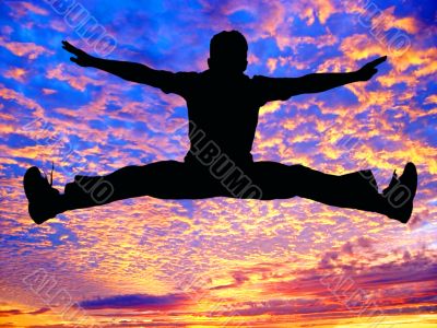 Boy jumping high in the air