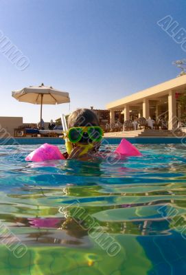 Kid in swimming pool
