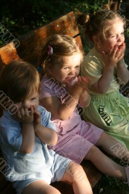 Three girls sitting outdoor