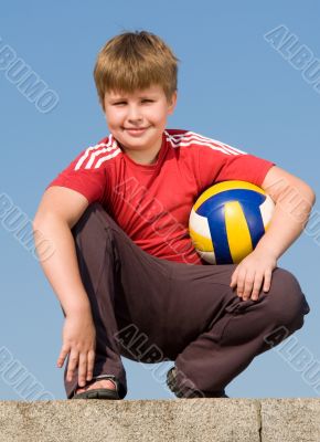 sitting boy with ball