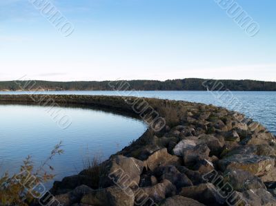 a rock barrier at a marina