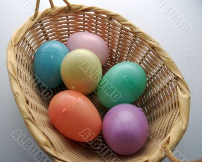 Colorful easter egg in a basket